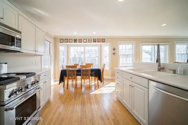 a kitchen with stainless steel appliances stove top oven and cabinets