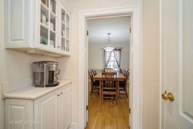 a kitchen with a table and chairs