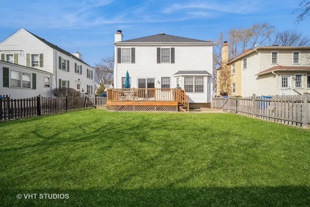 a front view of a house with a yard table and chairs