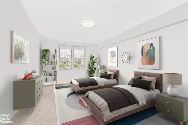 a bedroom with two beds and a large window