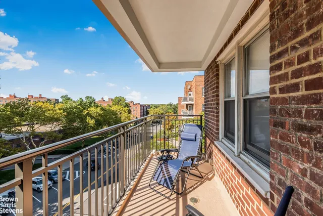 a view of balcony with furniture