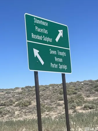 a sign on the side of a street