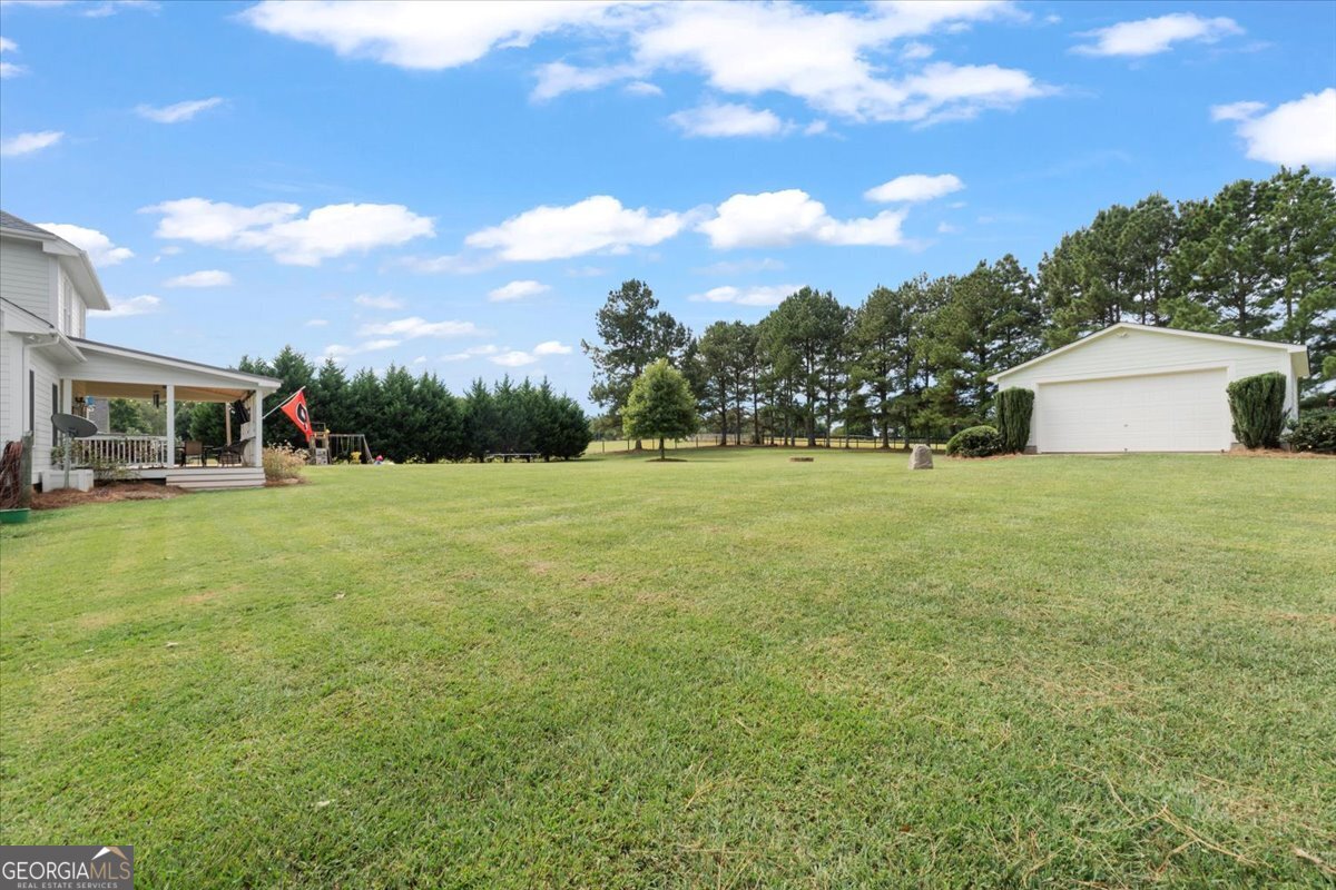 1670 Price Mill Road Bishop, GA 30621 - Photo 11 of 53 a view of a house with a yard