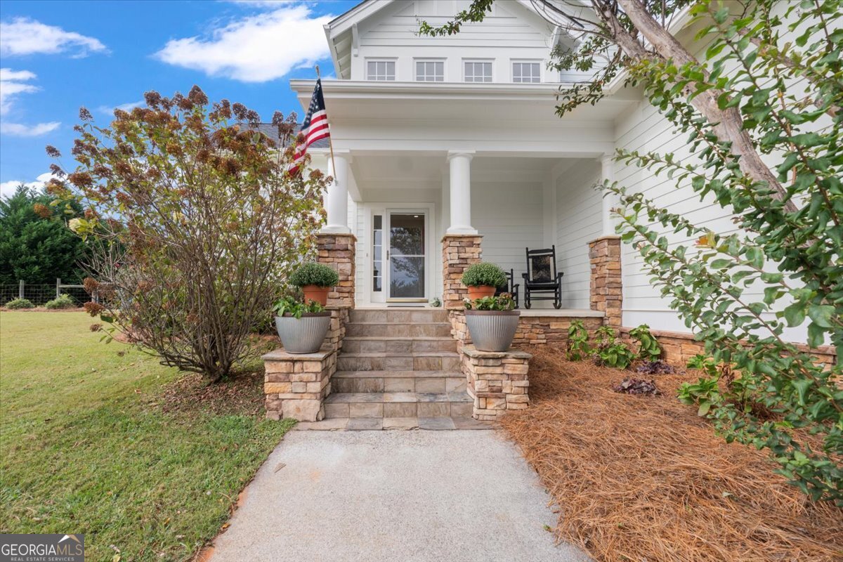 1670 Price Mill Road Bishop, GA 30621 - Photo 17 of 53 a view of a house with fountain and a trees