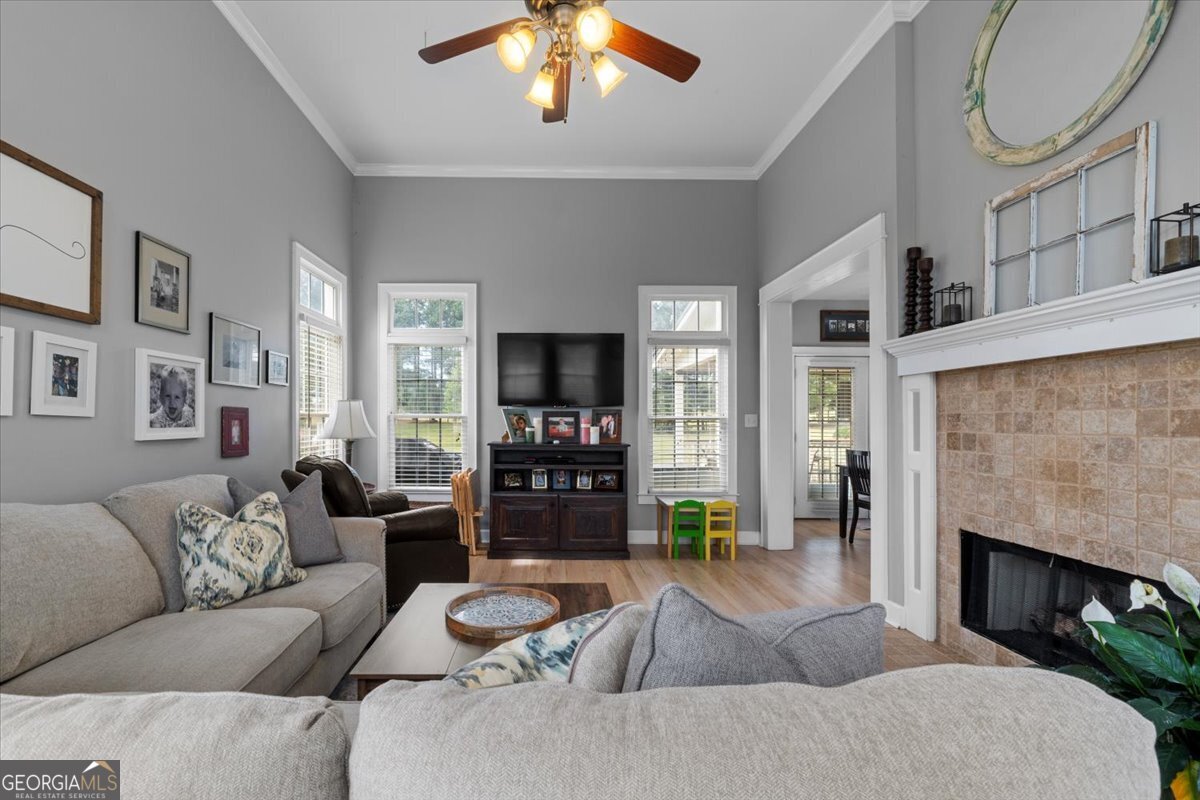 1670 Price Mill Road Bishop, GA 30621 - Photo 22 of 53 a living room with furniture and a fireplace