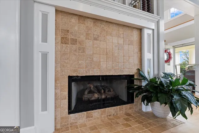 a view of a a dining room with furniture window and wooden floor