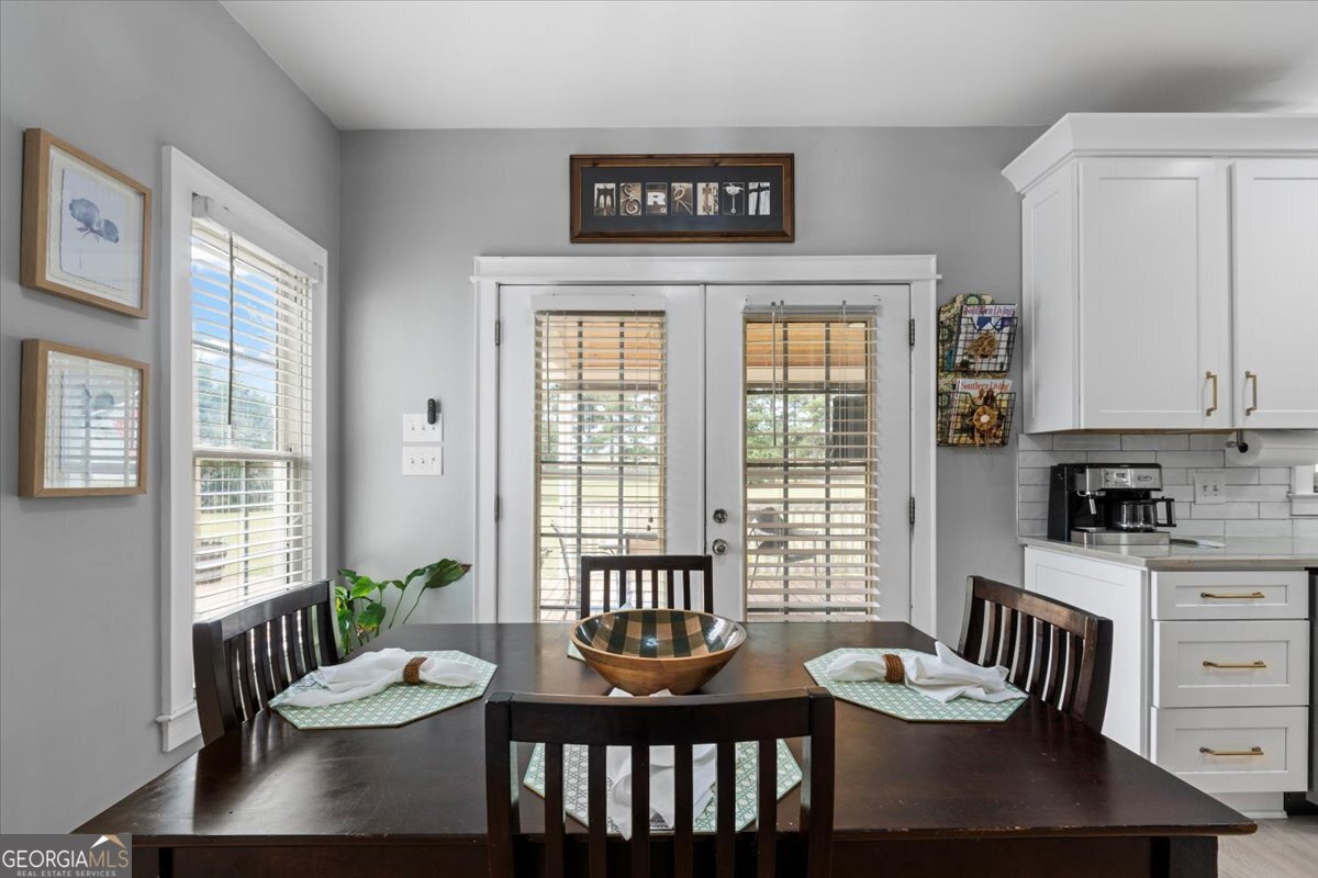 1670 Price Mill Road Bishop, GA 30621 - Photo 25 of 53 a view of a dining room with furniture window and wooden floor