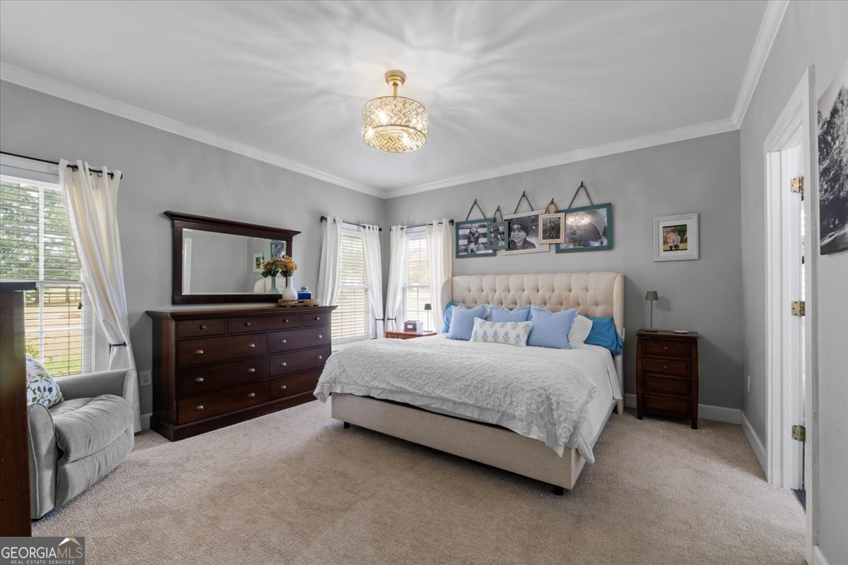 1670 Price Mill Road Bishop, GA 30621 - Photo 30 of 53 a bedroom with a bed and a dresser