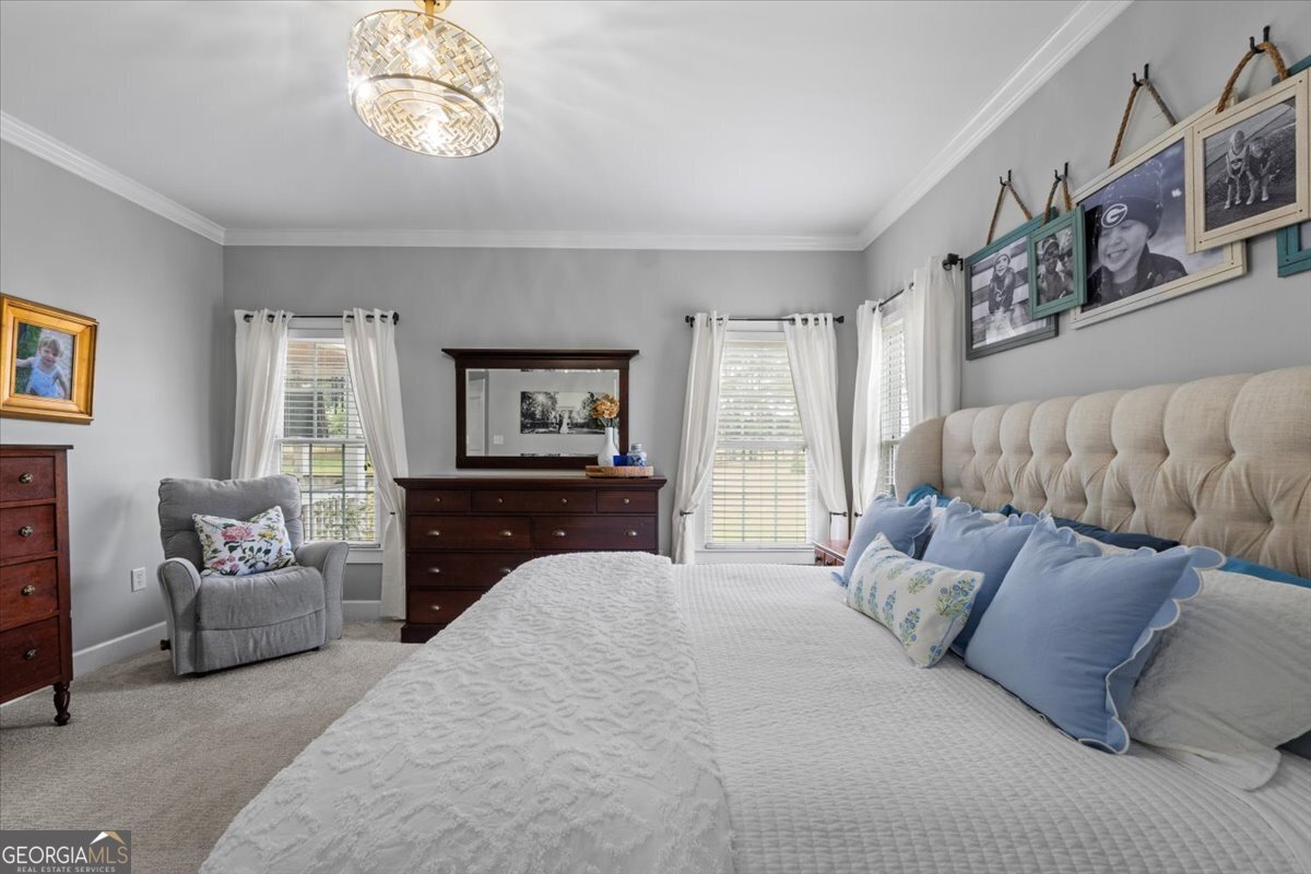 1670 Price Mill Road Bishop, GA 30621 - Photo 32 of 53 a bedroom with a large bed and a couch