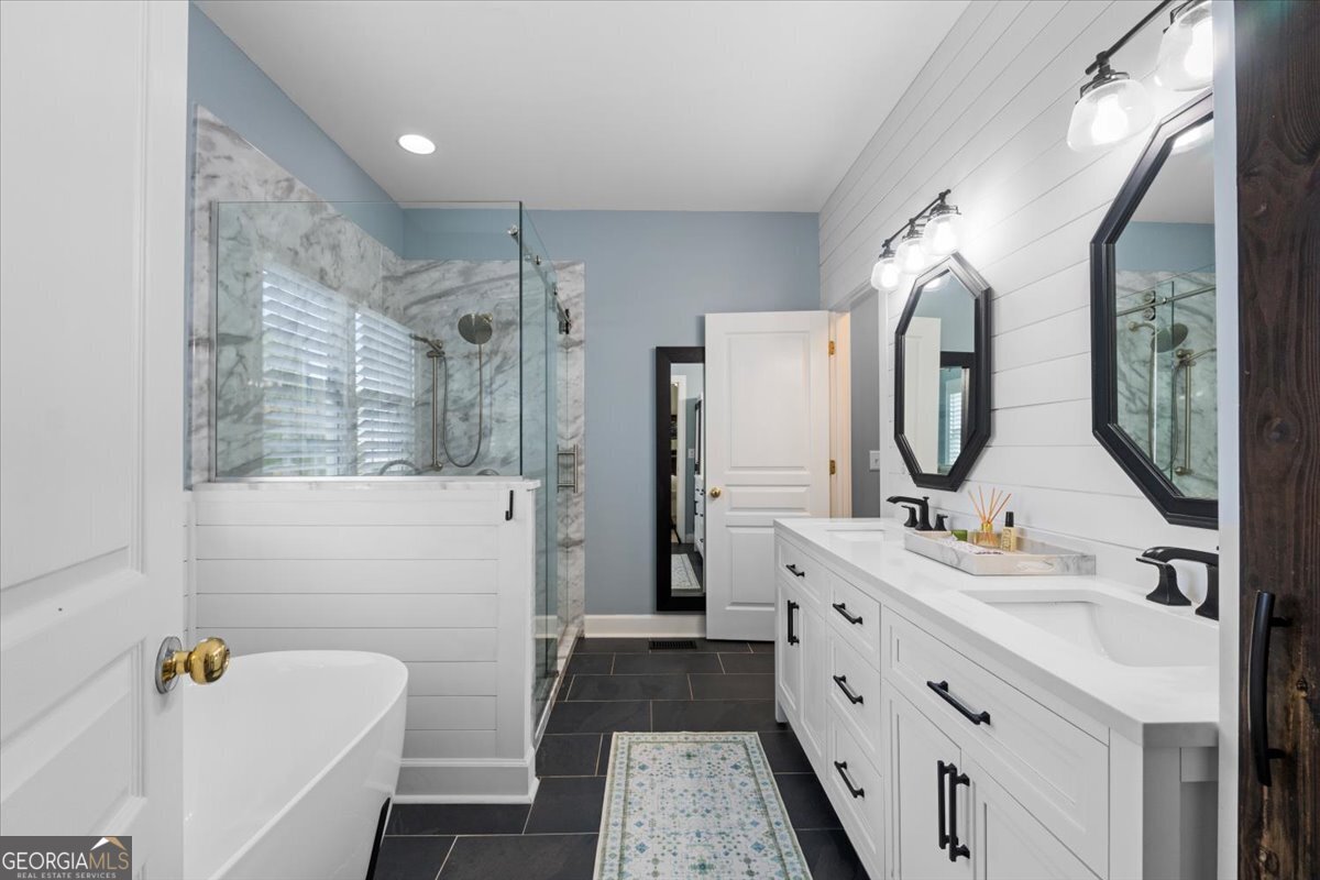 1670 Price Mill Road Bishop, GA 30621 - Photo 33 of 53 a bathroom with a double vanity sink mirror and shower
