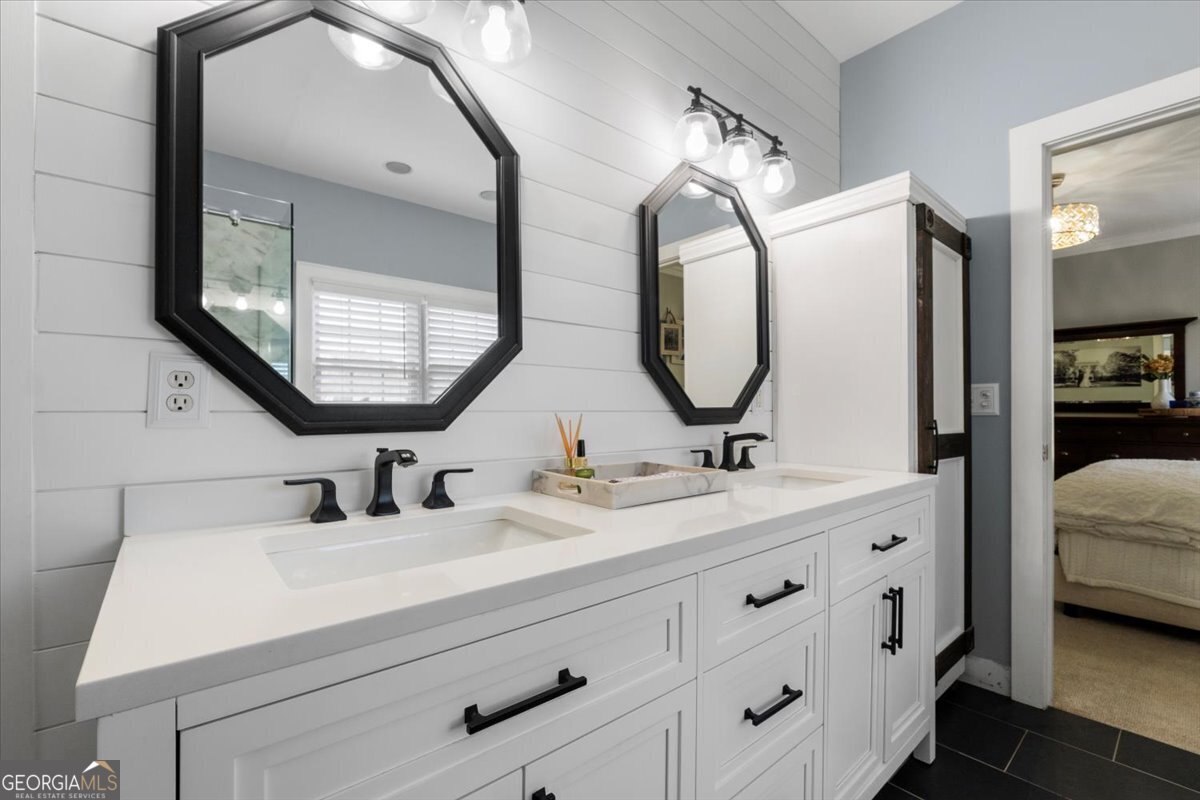 1670 Price Mill Road Bishop, GA 30621 - Photo 34 of 53 a en suite bathroom with double vanity and a mirror