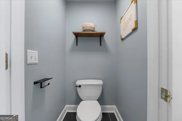 a bathroom with a sink and a washer dryer