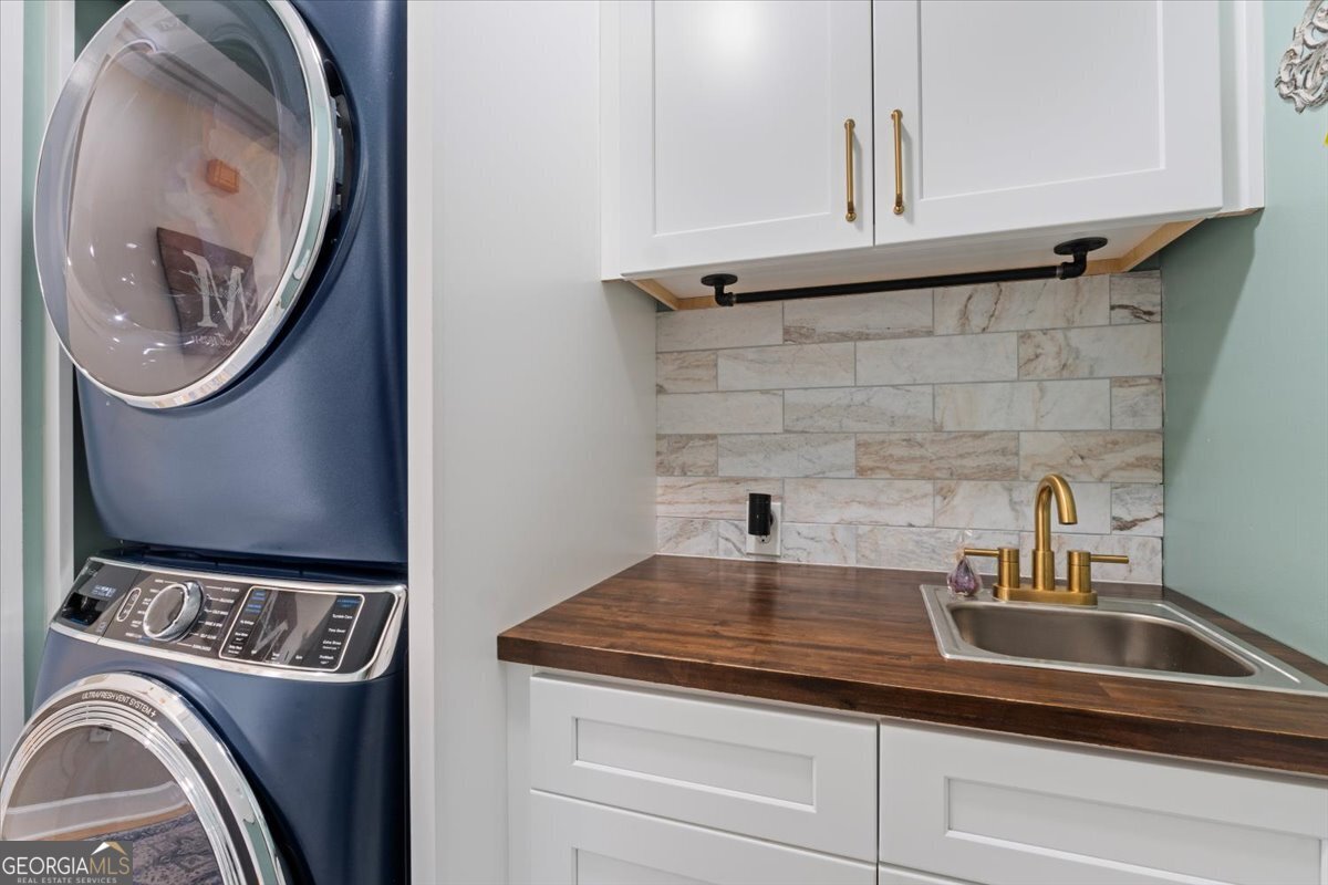 1670 Price Mill Road Bishop, GA 30621 - Photo 38 of 53 a bathroom with a sink and a washer dryer