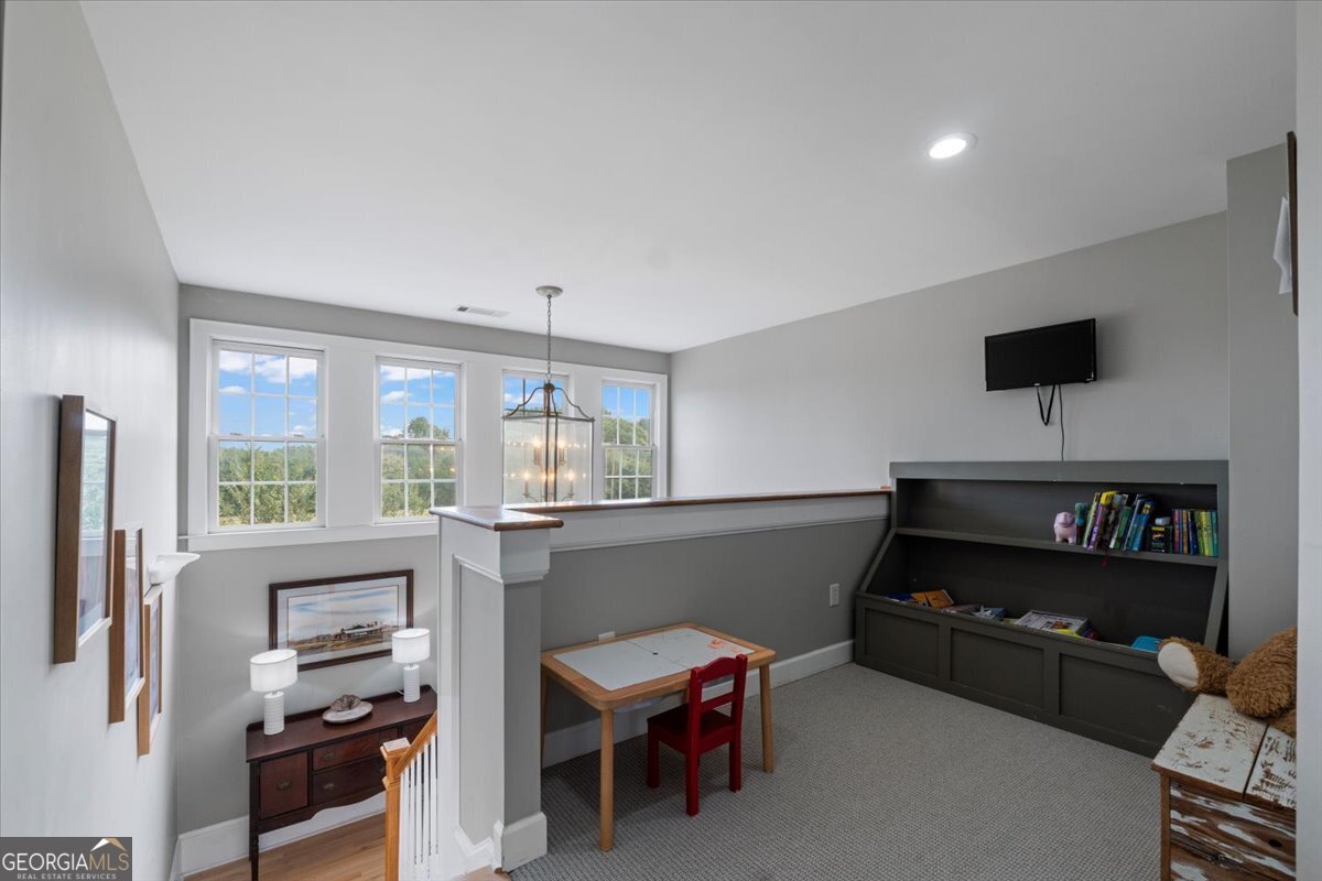 1670 Price Mill Road Bishop, GA 30621 - Photo 40 of 53 a living room with furniture and a flat screen tv