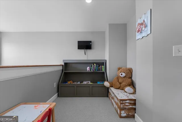 a view of a bedroom with baby toys