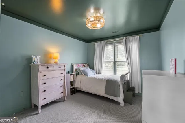 a room with furniture and a ceiling fan