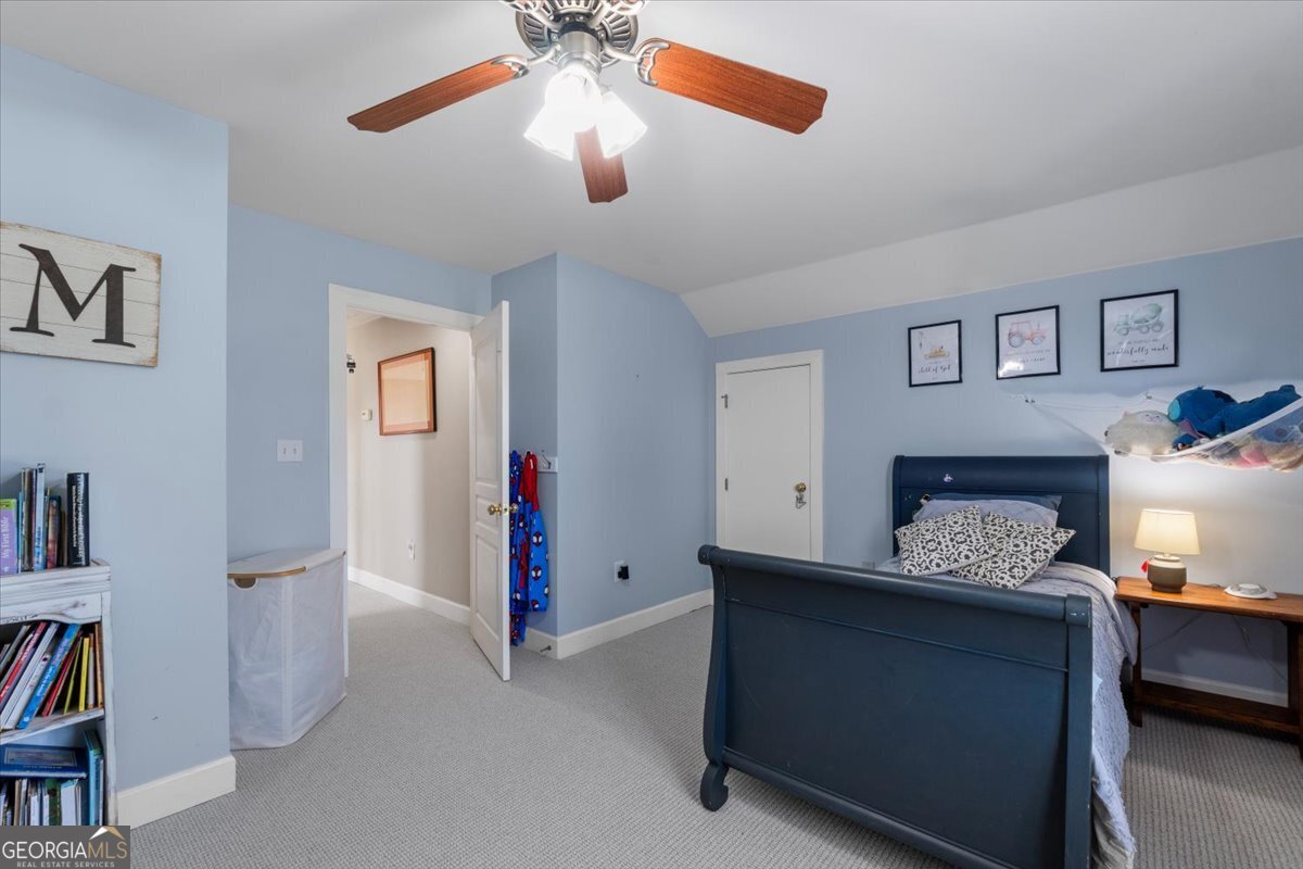 1670 Price Mill Road Bishop, GA 30621 - Photo 46 of 53 a living room with furniture and a bookshelf