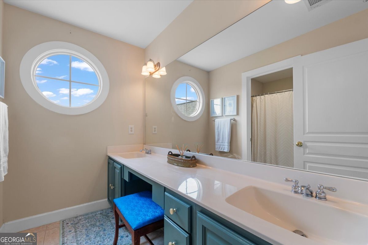 1670 Price Mill Road Bishop, GA 30621 - Photo 48 of 53 a bathroom with a sink and a mirror
