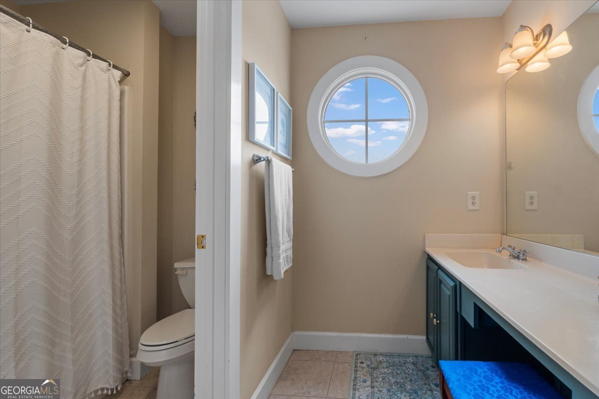 1670 Price Mill Road Bishop, GA 30621 - Photo 49 of 53 a bathroom with a sink and a mirror