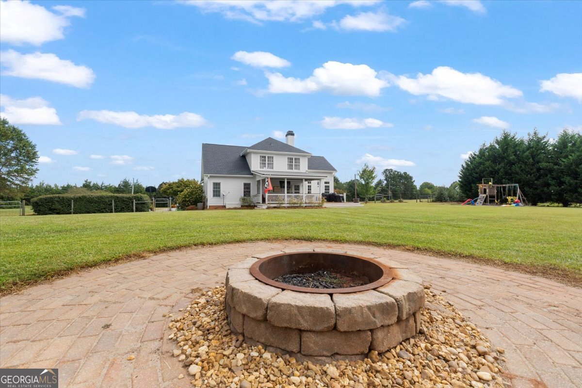 1670 Price Mill Road Bishop, GA 30621 - Photo 52 of 53 a swimming pool with outdoor seating and garden