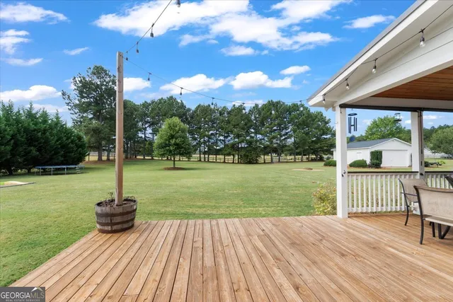 a view of a deck with a yard