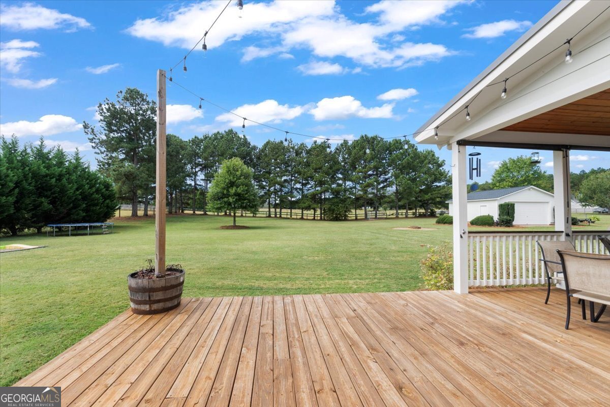 1670 Price Mill Road Bishop, GA 30621 - Photo 7 of 53 a view of a deck with a yard