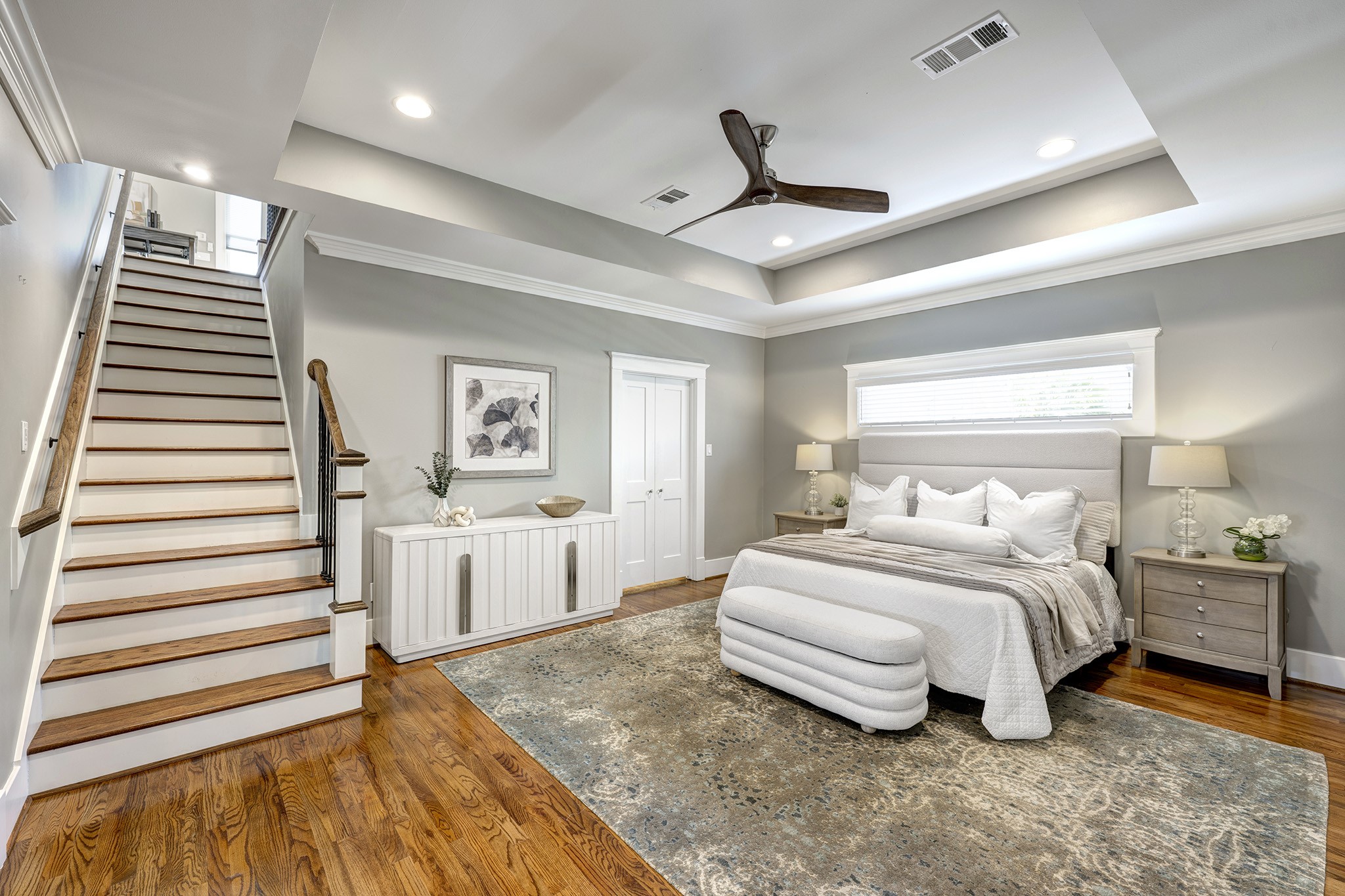 1314 Harvard Street Houston, TX 77008 - Photo 12 of 36 a spacious bedroom with a bed and a chandelier