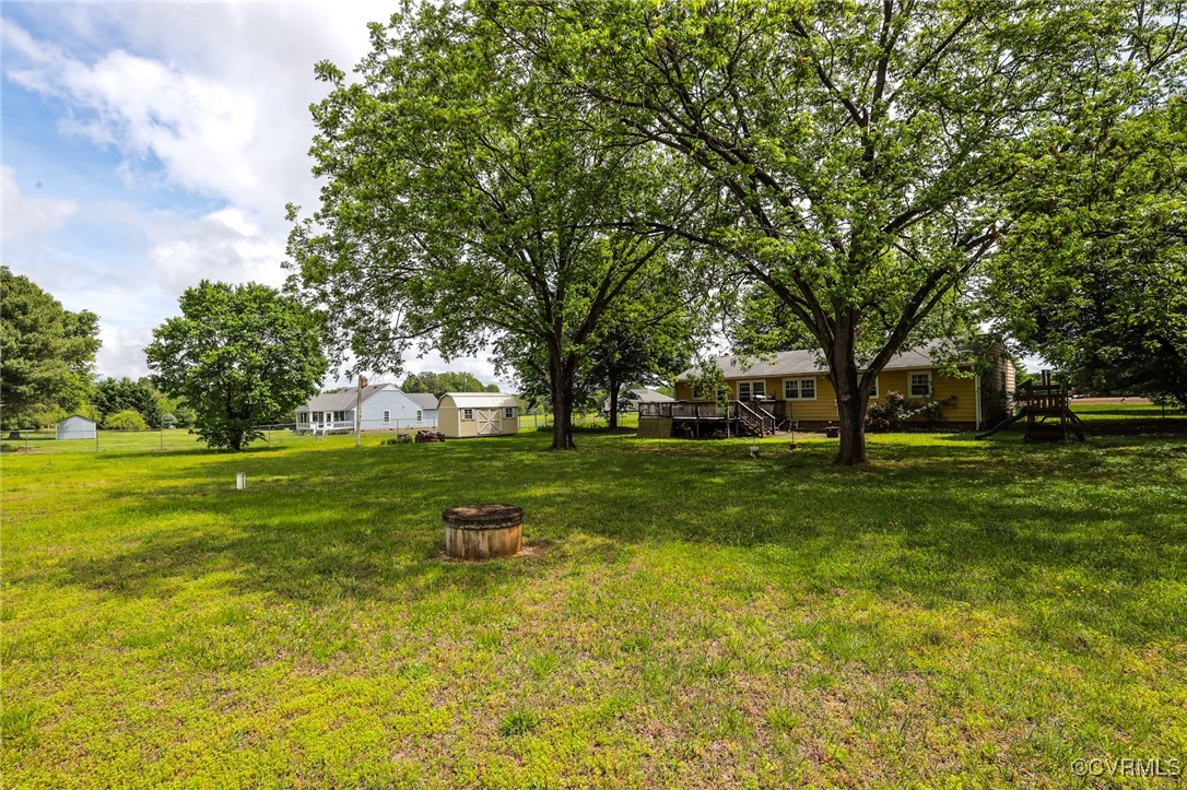 8229 Little Florida Road Mechanicsville, VA 23111 - Photo 17 of 40 View of yard featuring a wooden deck