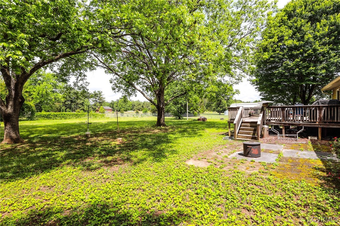 8229 Little Florida Road Mechanicsville, VA 23111 - Photo 19 of 40 View of yard featuring a deck and stairs
