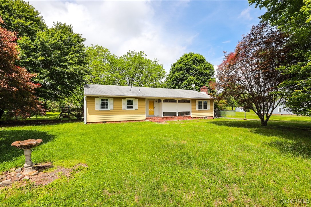 8229 Little Florida Road Mechanicsville, VA 23111 - Photo 2 of 40 View of front facade with a front lawn and a chimn
