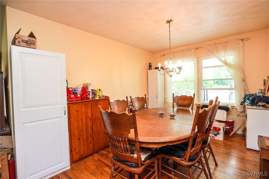 8229 Little Florida Road Mechanicsville, VA 23111 - Photo 26 of 40 Dining space featuring a notable chandelier and ha