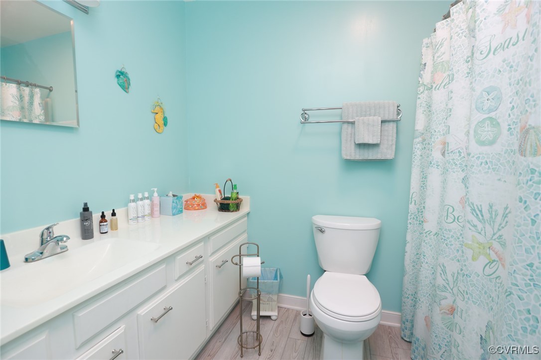 8229 Little Florida Road Mechanicsville, VA 23111 - Photo 37 of 40 Bathroom featuring toilet, a shower with shower cu