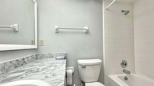 a bathroom with a sink and toilet