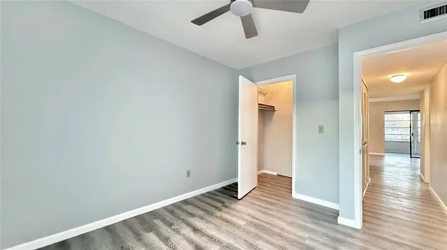 a view of an empty room and wooden floor