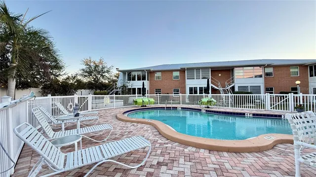 a view of a swimming pool with a patio