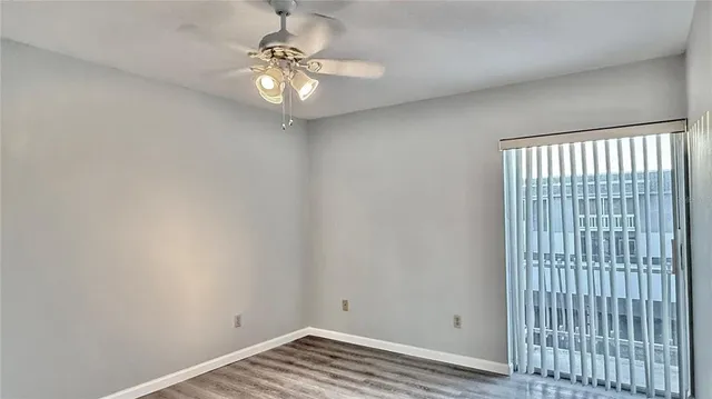 a view of a livingroom with a chandelier fan