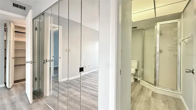 a view of a bathroom with a shower and a sink