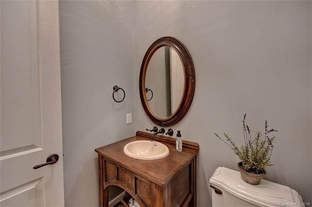 146 Dedham Loop Mooresville, NC 28117 - Photo 14 of 29 a bathroom with a sink and a mirror