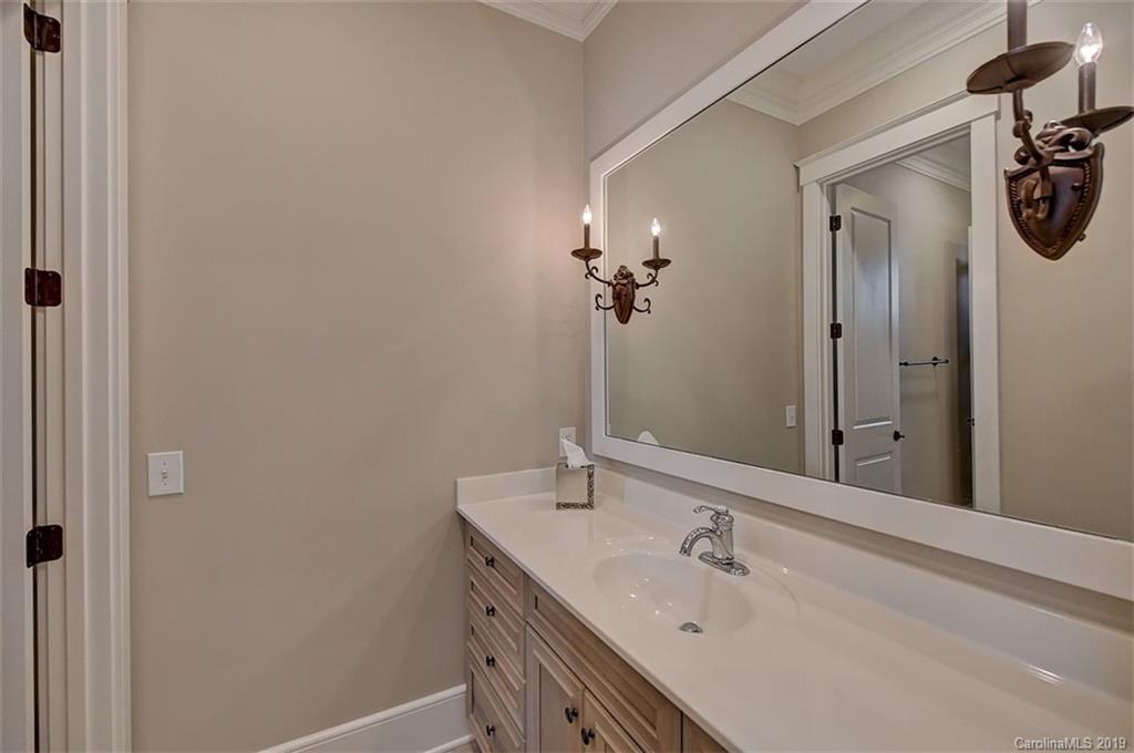 146 Dedham Loop Mooresville, NC 28117 - Photo 19 of 29 a bathroom with a sink a mirror and vanity