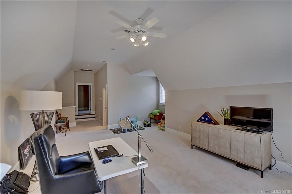 146 Dedham Loop Mooresville, NC 28117 - Photo 22 of 29 a living room with furniture and a flat screen tv