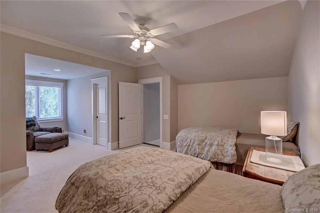 146 Dedham Loop Mooresville, NC 28117 - Photo 23 of 29 a spacious bedroom with two beds and a chandelier