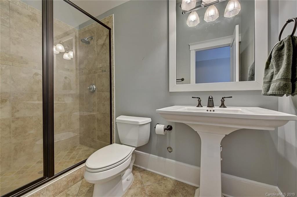146 Dedham Loop Mooresville, NC 28117 - Photo 24 of 29 a bathroom with a sink toilet and shower