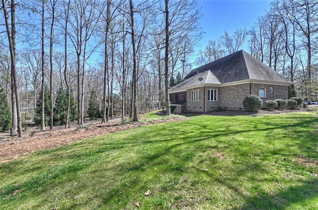 146 Dedham Loop Mooresville, NC 28117 - Photo 28 of 29 a view of house with a big yard and large trees