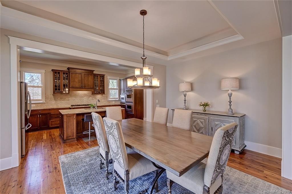 146 Dedham Loop Mooresville, NC 28117 - Photo 8 of 29 a view of a dining room with furniture wooden floor and chandelier