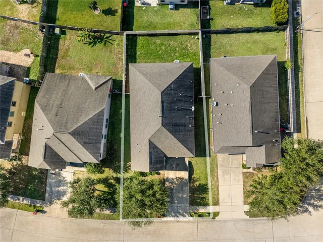 an aerial view of houses and roads