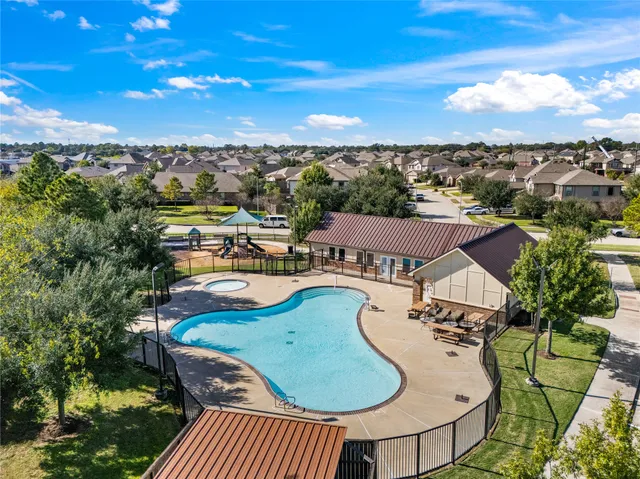 an aerial view of residential houses with outdoor space