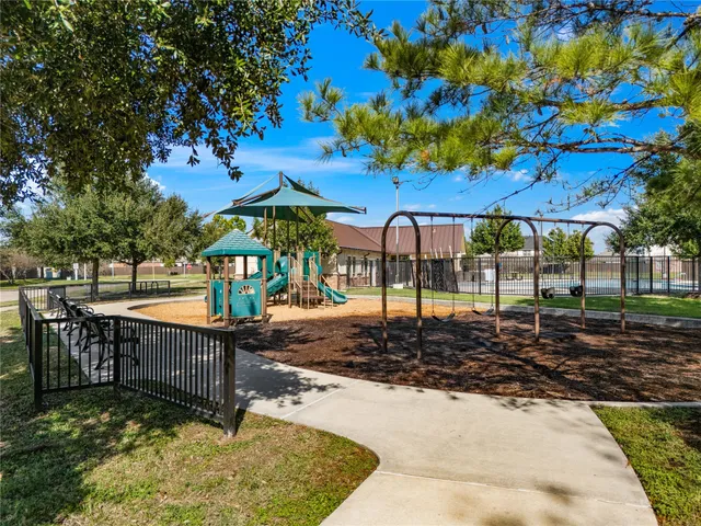 a view of a backyard with sitting area