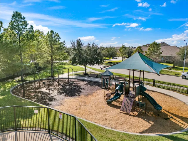 a view of a backyard with sitting area