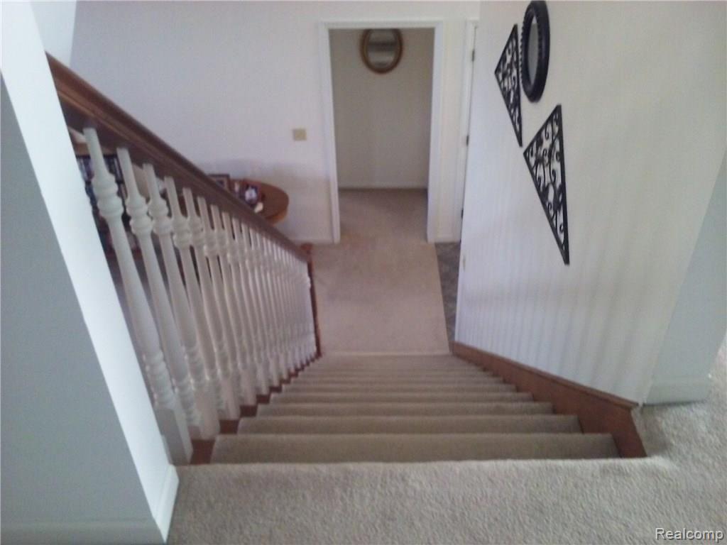 4660 Capac Road Capac, MI 48014 - Photo 38 of 65 This is a view of the staircase looking down.