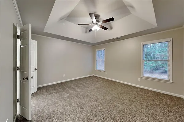 a view of an empty room with a window